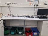 an image of a lab with a desk and a laptop