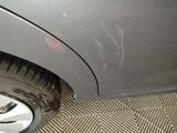 a close up of a car with a tire on the ground