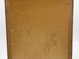 an old book with a brown cover sitting on top of a white surface