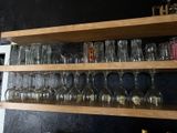 many glasses on the shelves in the kitchen