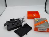 an image of a photo studio with a white background and a black and orange box