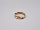 a gold ring with two inter bands on a white surface