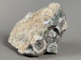 a close up of a rock on a gray surface