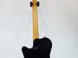 an electric guitar on a stand against a white background