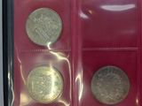 three different types of coins are in a red case