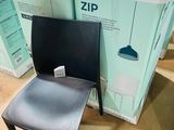 a chair that is sitting in front of a box