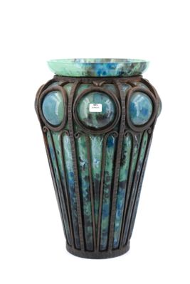 a vase that has a blue and green design on it