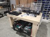 a workbench with a lot of tools on top of it