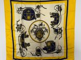 a yellow and black scarf with a picture of a horse and carriage on it