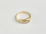 an image of a gold ring with a diamond in the middle