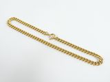 a gold chain with a clasp on a white background