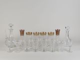 a lot of glasses and vases sitting on a table