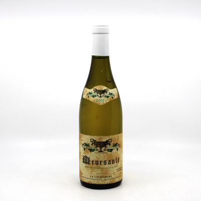 a bottle of wine that is sitting on a table