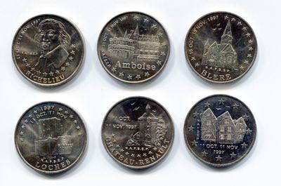 six different quarters of the united states are shown on a white surface