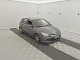 a car that is parked in a room with a checkered floor