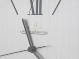 a close up of a clock with roman numerals on it