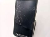 the samsung galaxy s is broken and sitting on the table