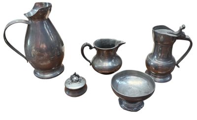 several pieces of antique silverware including a pitcher, bowl, and spoon