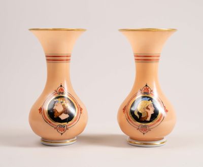two vases with a picture of a man and a woman on them