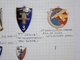 a lot of badges that are on a piece of paper