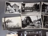 several old black and white photos of a street and buildings