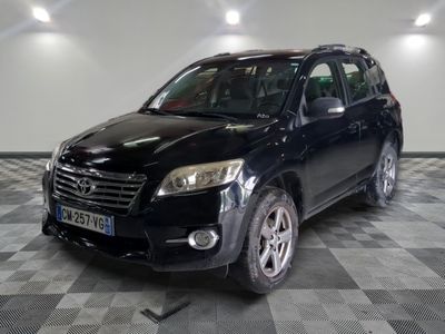 a picture of a black toyota rav parked in a garage