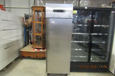 an image of a refrigerator in a store with other items in the background