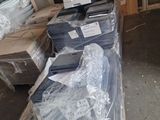 a lot of boxes of computer equipment sitting on the floor