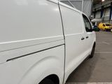 a white van that is parked in a parking lot