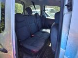 a van that has the door open and the seats down
