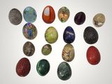 a lot of different colored stones on a white surface