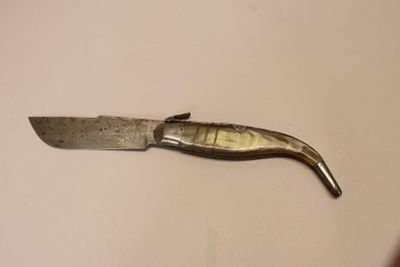 a knife that is laying on a table