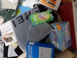 a plastic bag full of items that are sitting on the floor