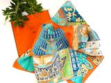 many different pieces of cloth on the table