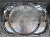 a silver tray that has a decorative design on it