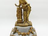 an image of a statue of a woman pouring water from a fountain