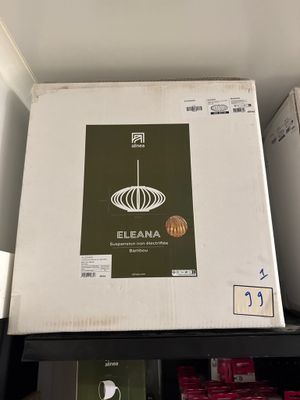 une boîte blanche sur laquelle est représentée une lampe