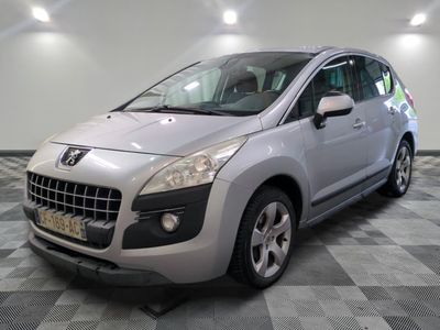 a picture of a silver car parked in a garage