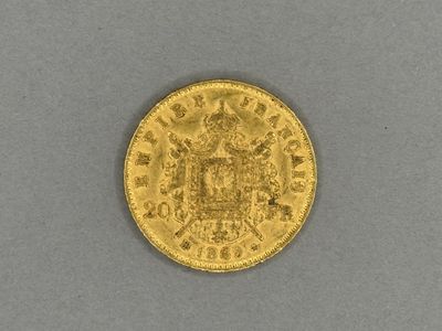 a gold sovereign coin with a crown on it