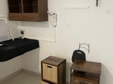 a bathroom with a sink and a cabinet in it