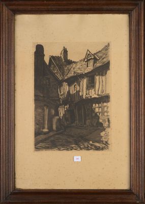 an old picture of a building with a clock on the top of it