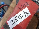 a red fire hydrant that has a sticker on it