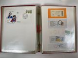 a open book with stamps on it sitting on a table