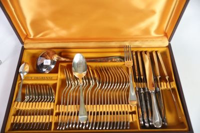 a box with a bunch of forks and spoons inside of it