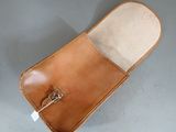 an image of a leather case with a metal buckle on it