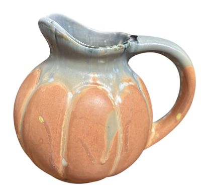 an image of a ceramic pitcher on a white background