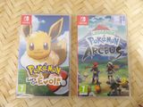two nintendo wii games sitting on a table next to each other