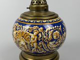 an image of a blue and gold vase sitting on top of a table