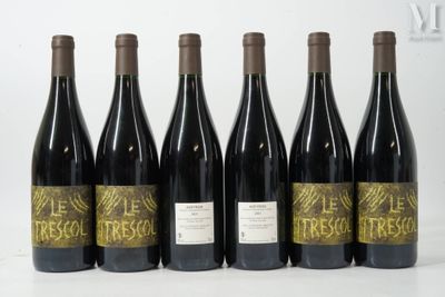 six bottles of wine are lined up in a row on a table
