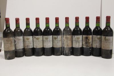 several bottles of wine are lined up in a row on a table